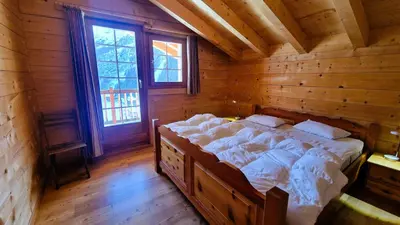 Ein Bett oder Betten in einem Zimmer der Unterkunft Chalet La Giete 6 personnes La Forclaz