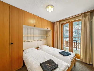 Ein Bett oder Betten in einem Zimmer der Unterkunft Lift Bear Lodge - 4Valleys - Swiss Alps