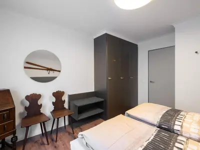 Ein Bett oder Betten in einem Zimmer der Unterkunft Apartment Wohnung Edelweiss direkt in 4 Sterne Hotel by Interhome