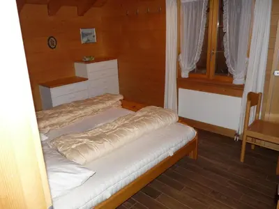 Ein Bett oder Betten in einem Zimmer der Unterkunft Apartment Chalet Kiefer by Interhome