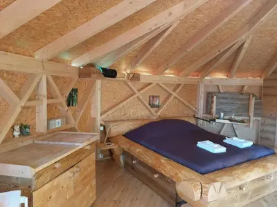 Ein Bett oder Betten in einem Zimmer der Unterkunft Holiday Home Einzigartige Holzhütte mit Bergpanorama by Interhome