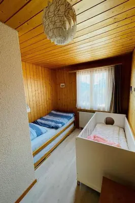 Ein Bett oder Betten in einem Zimmer der Unterkunft Apartment Chalet Hofer by Interhome
