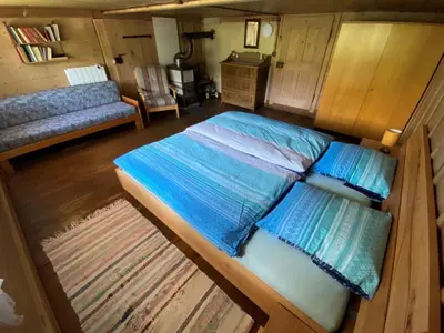 Ein Bett oder Betten in einem Zimmer der Unterkunft Holiday Home Schönenmatte by Interhome