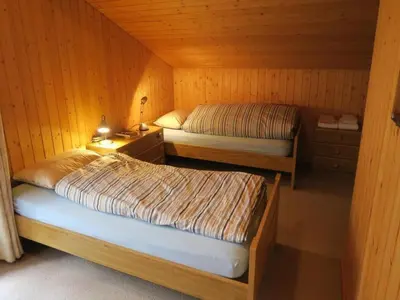 Ein Bett oder Betten in einem Zimmer der Unterkunft Apartment Nora 5 Bett Wohnung by Interhome
