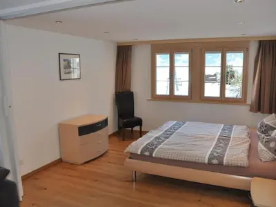 Ein Bett oder Betten in einem Zimmer der Unterkunft Apartment im Chalet Adelheid by Interhome