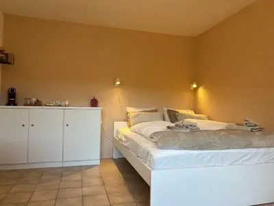 Ein Bett oder Betten in einem Zimmer der Unterkunft Studio Salute - cosy et confort pour 2 personnes