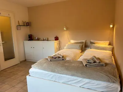 Ein Bett oder Betten in einem Zimmer der Unterkunft Studio Salute - cosy et confort pour 2 personnes