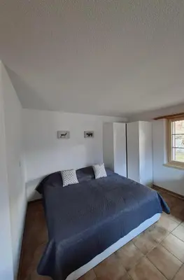 Ein Bett oder Betten in einem Zimmer der Unterkunft Studio Chalet Edelweiss