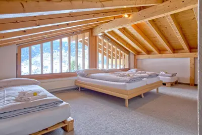 Ein Bett oder Betten in einem Zimmer der Unterkunft Apartment Eiger Sun - GRIWA RENT AG