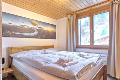 Ein Bett oder Betten in einem Zimmer der Unterkunft Apartment Eiger Sun - GRIWA RENT AG