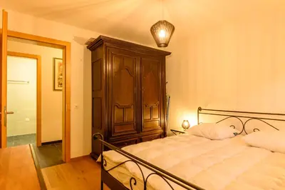 Ein Bett oder Betten in einem Zimmer der Unterkunft Résidence Lisaride à Evolène - appartement spacieux et lumineux avec vue