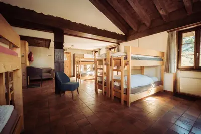 Ein Bett oder Betten in einem Zimmer der Unterkunft Grünsee Mountain Lodge