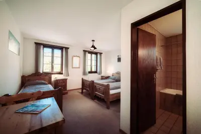 Ein Bett oder Betten in einem Zimmer der Unterkunft Grünsee Mountain Lodge