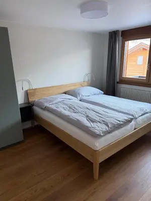 Ein Bett oder Betten in einem Zimmer der Unterkunft Alpine Lodge Münster VS moderne Eigentumswohnung