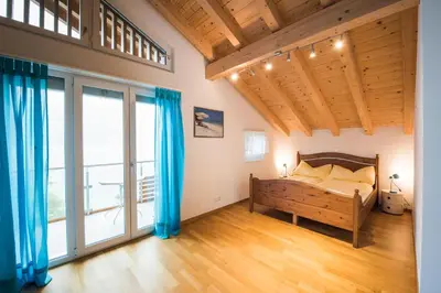 Ein Bett oder Betten in einem Zimmer der Unterkunft Bellavista - Direct lake view