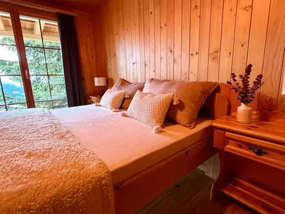 Ein Bett oder Betten in einem Zimmer der Unterkunft La Marmotte
