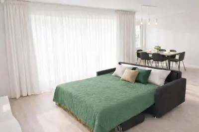 Ein Bett oder Betten in einem Zimmer der Unterkunft Exklusiv Bijou in Thun Interlaken - Swiss Adventure