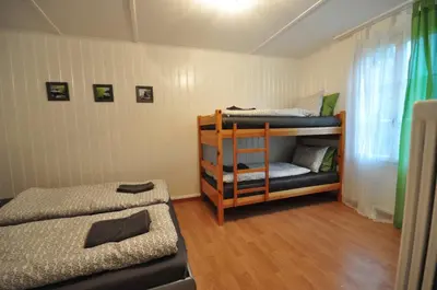 Ein Bett oder Betten in einem Zimmer der Unterkunft Interlaken Town House Sleeps 12 guests Central
