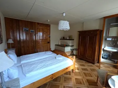 Ein Bett oder Betten in einem Zimmer der Unterkunft Edelweiss Lodge