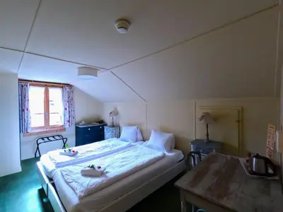 Ein Bett oder Betten in einem Zimmer der Unterkunft Edelweiss Lodge