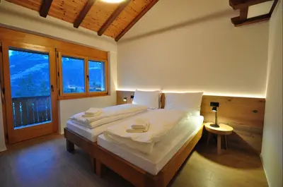 Ein Bett oder Betten in einem Zimmer der Unterkunft Tossu, Haus Metropol B