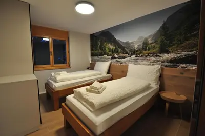 Ein Bett oder Betten in einem Zimmer der Unterkunft Tossu, Haus Metropol B