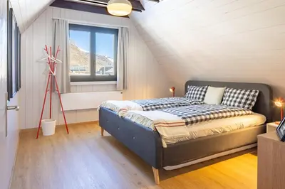 Ein Bett oder Betten in einem Zimmer der Unterkunft Boutique Ferienhaus mit Sauna - TheHerbertRealp