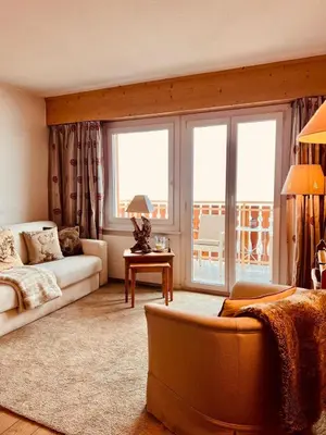 Ein Sitzbereich in der Unterkunft Appartement complet dans le centre de Crans-Montana