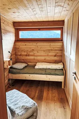 Ein Bett oder Betten in einem Zimmer der Unterkunft Holiday Home Val d'Hérens - Chalet La grange à Marcel - Die Scheune von Marcel by Interhome