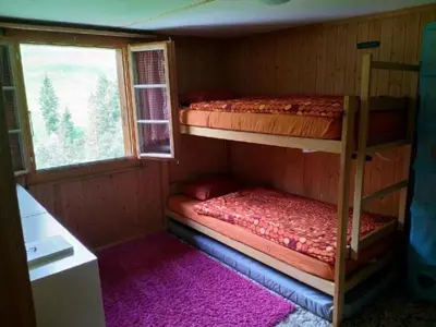 Ein Bett oder Betten in einem Zimmer der Unterkunft Holiday Home Willenschwand Adelboden by Interhome
