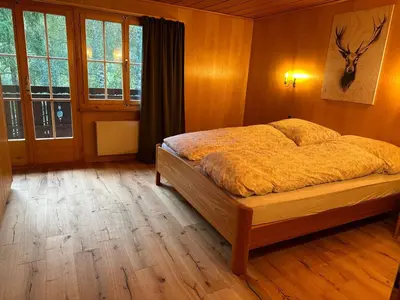 Ein Bett oder Betten in einem Zimmer der Unterkunft Holiday Home Chalet Finkenwiese - für 8 Erwachsene und 5 Kinder by Interhome