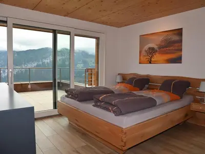 Ein Bett oder Betten in einem Zimmer der Unterkunft Apartment Panorama-Beatenberg by Interhome