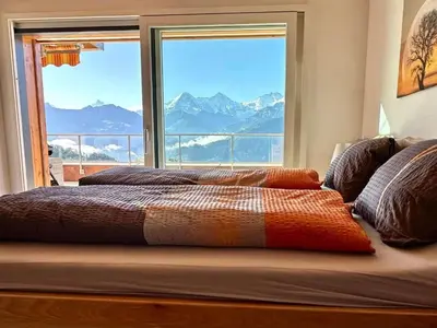 Ein Bett oder Betten in einem Zimmer der Unterkunft Apartment Panorama-Beatenberg by Interhome
