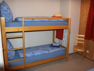 Ein Bett oder Betten in einem Zimmer der Unterkunft Apartment Trollhütte 4-Bett-Wohnung by Interhome