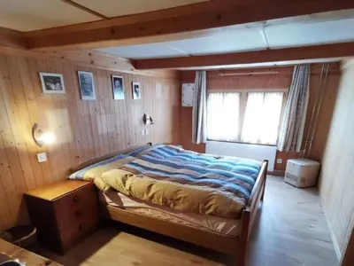 Ein Bett oder Betten in einem Zimmer der Unterkunft Holiday Home mit Bergblick by Interhome