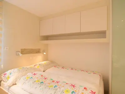 Ein Bett oder Betten in einem Zimmer der Unterkunft Apartment Haus Flaminia by Interhome