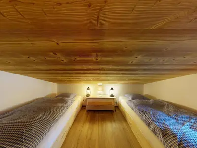Ein Bett oder Betten in einem Zimmer der Unterkunft Apartment Chalet Wieseli by Interhome