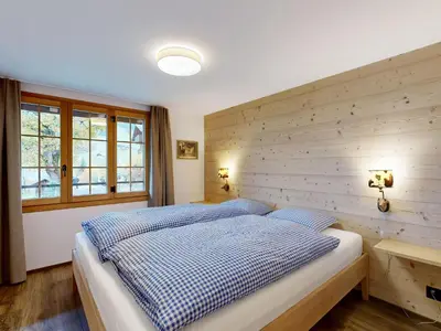 Ein Bett oder Betten in einem Zimmer der Unterkunft Apartment Chalet Wieseli by Interhome