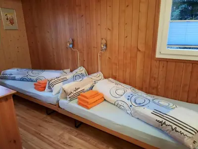 Ein Bett oder Betten in einem Zimmer der Unterkunft Apartment Chalet Bergfrieden by Interhome