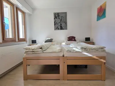 Ein Bett oder Betten in einem Zimmer der Unterkunft Apartment Gentiana Haus B by Interhome