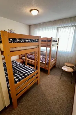 Ein Bett oder Betten in einem Zimmer der Unterkunft Apartment Gemütliche Ferienwohnung im Zentrum Sörenberg by Interhome