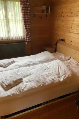 Ein Bett oder Betten in einem Zimmer der Unterkunft Apartment Chalet Bacchus - OG by Interhome