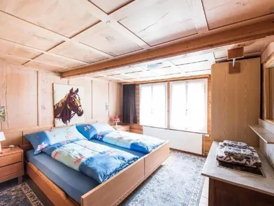 Ein Bett oder Betten in einem Zimmer der Unterkunft Holiday Home Wüthrich by Interhome