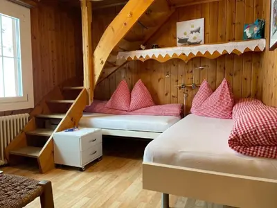 Ein Bett oder Betten in einem Zimmer der Unterkunft Apartment Bärengaden 4-Bettwohnung by Interhome