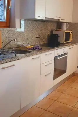 Küche/Küchenzeile in der Unterkunft Apartment MAva -Haus mit Blick aufs Wasser by Interhome