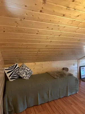 Ein Bett oder Betten in einem Zimmer der Unterkunft Mayen unique et authentique