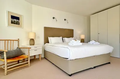 Ein Bett oder Betten in einem Zimmer der Unterkunft Eiger Residence 2