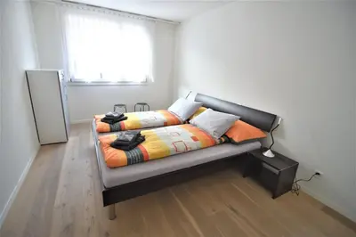 Ein Bett oder Betten in einem Zimmer der Unterkunft In the Heart of Interlaken