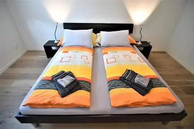 Ein Bett oder Betten in einem Zimmer der Unterkunft In the Heart of Interlaken
