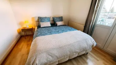 Ein Bett oder Betten in einem Zimmer der Unterkunft Cozy Apartment in Spiez with fantastic view